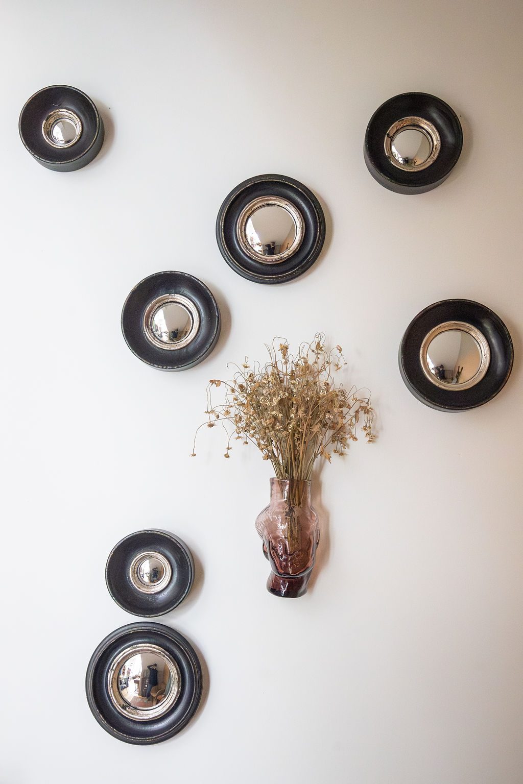 Convex mirrors arranged on the gallery wall