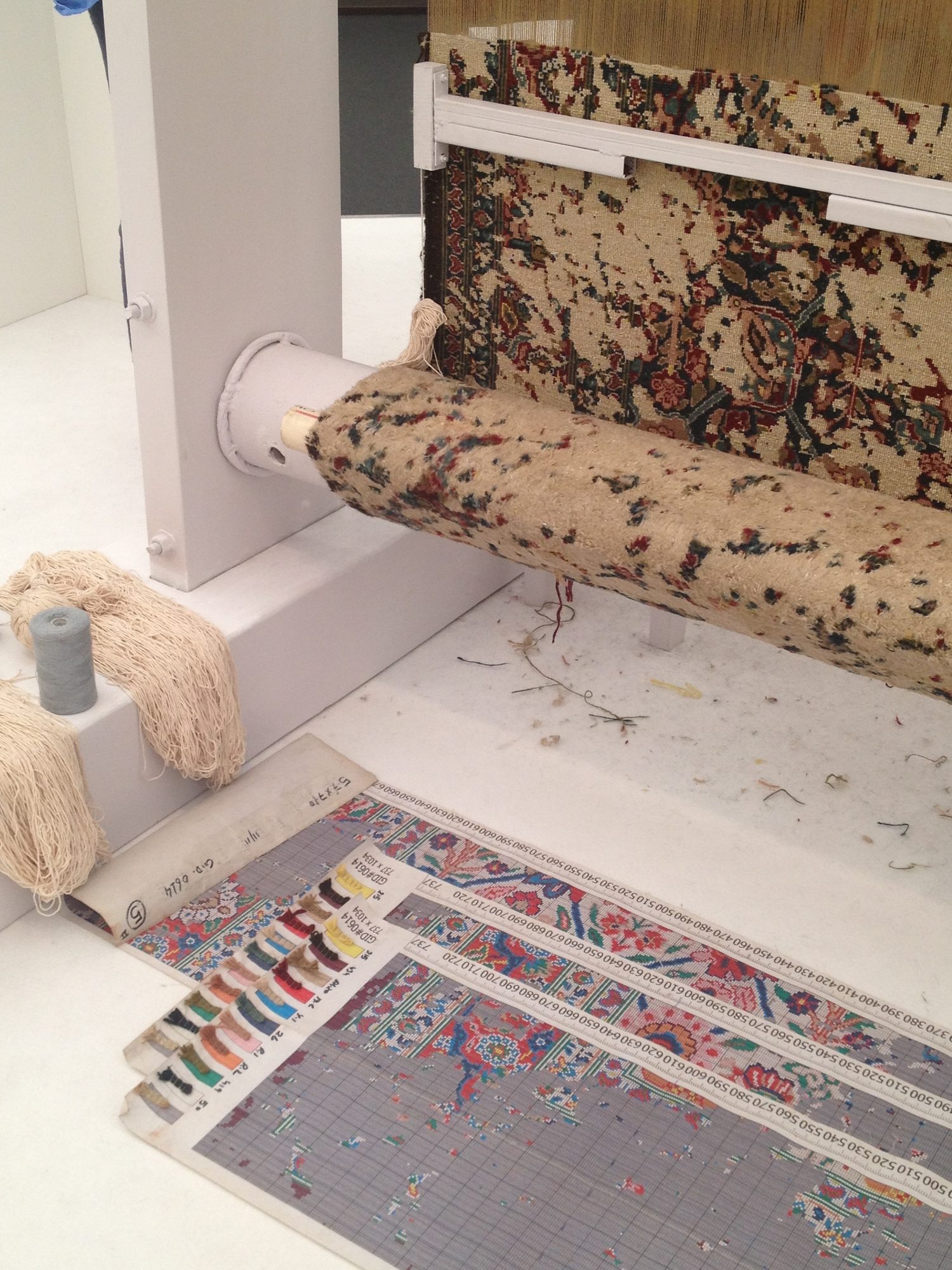 Detail of a portion of the rug on the loom….a complex modern design……one that is incredibly intricate and complicated to hand weave. The pattern guide and color chart are shown below. Amazing.