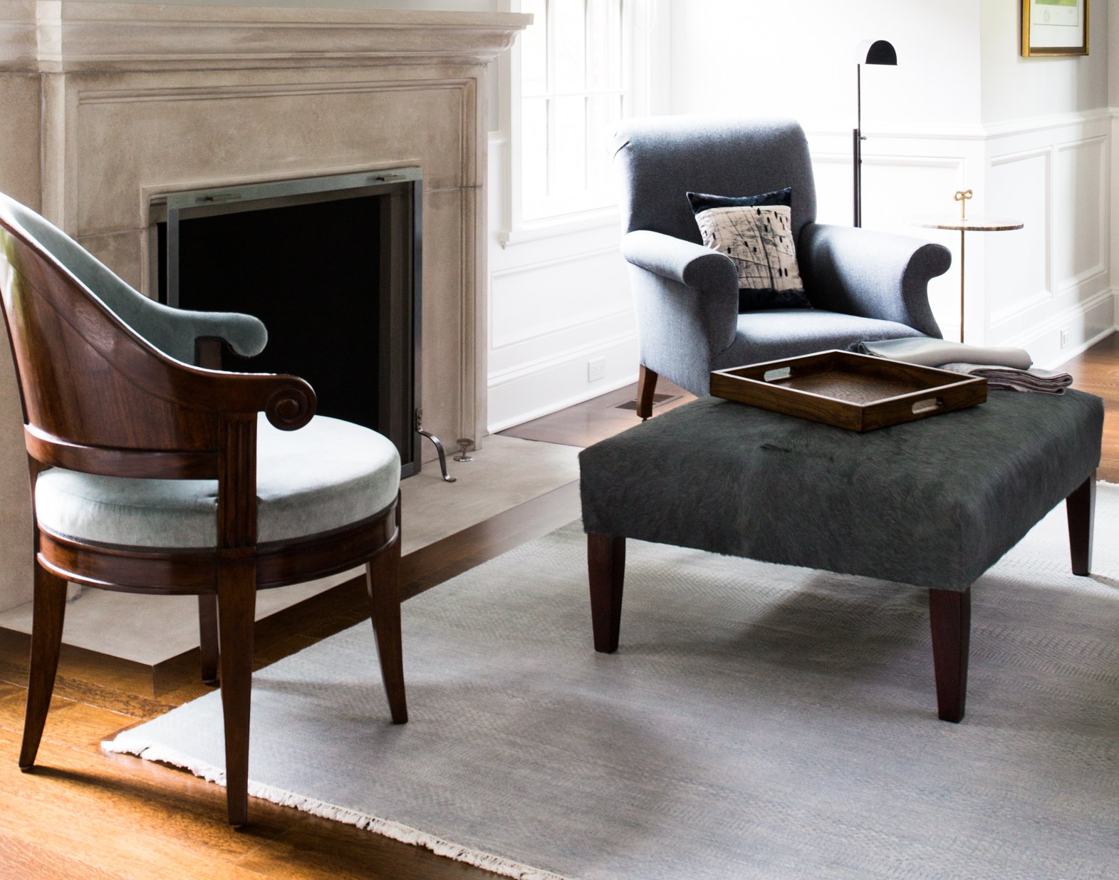 Living room with fireplace and blue armchairs, Suburban Serenity