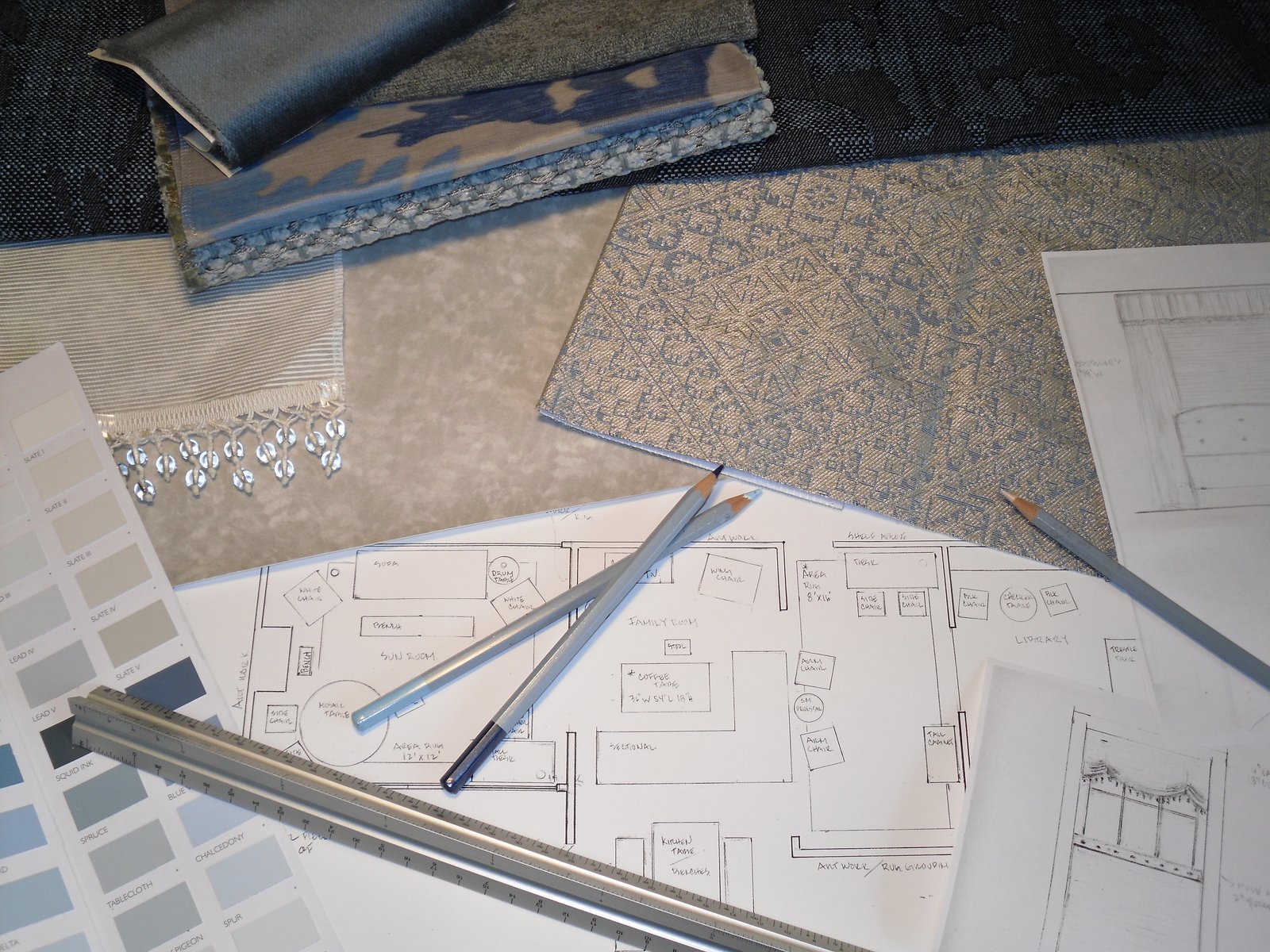 Floor plan sketches with fabric, tile and paint samples
